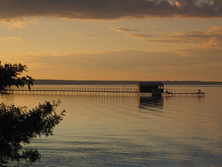 Sunset, summer, beautiful clouds at sunset. Pier on the big Kama river. Ural, Russia, Perm...
