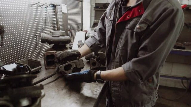 Auto mechanic repairing a car in a workshop.car repair concept