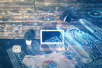 Desktop computer background in office and big town buildings hologram drawing. Double exposure. Smart city concept.