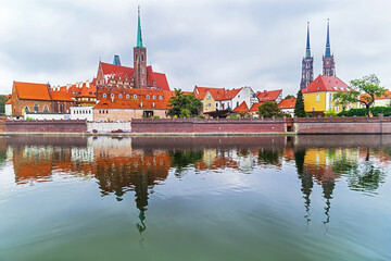 Wroclaw. Picturesque view of famous, old island Tumski with cathedral of St. John reflection in the Odra river.