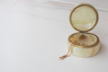 Fototapeta premium old vintage onyx casket on a white background. onyx slice. top view.