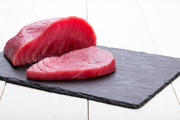 Raw tuna on cutting board