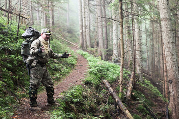 Active healthy man hiking in beautiful forest