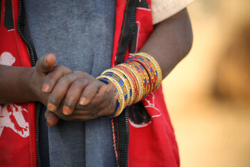 Hand of a girl wearing colorful bangles at Pushkar Camel Fair (Cattle Mela)