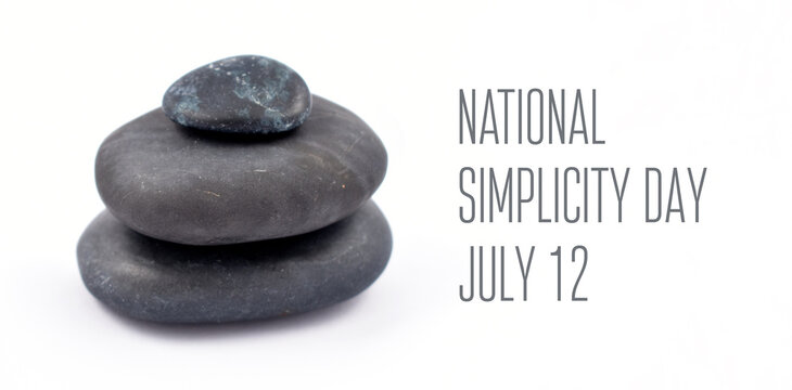National Simplicity Day stock images. A tribute to Henry David Thoreau. Black stones on a white background. Pile of black lava stones. Simplicity Day Poster, July 12. Important day