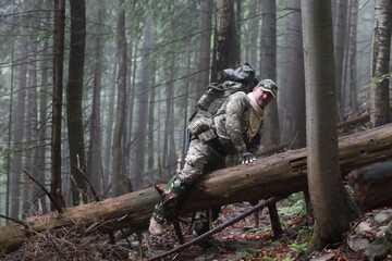 Active healthy man hiking in beautiful forest