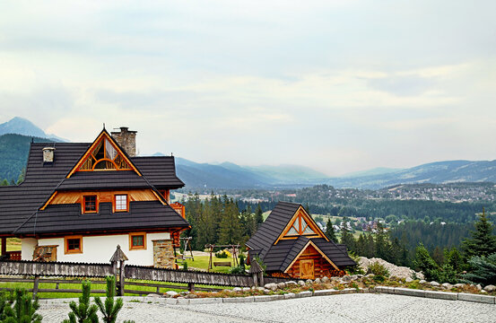 Guest House In The Traditional Mountain Style And Mountain Landscape. Not Far From Zakopane. Tatra Mountains. Poland.