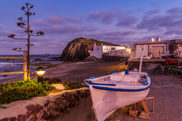   Traditional fishing boat on the beach at dusk at La Isleta del Moro, Cabo de Gata-Níjar Natural Park, Almería province, Andalusia, Spain © inigolaitxu