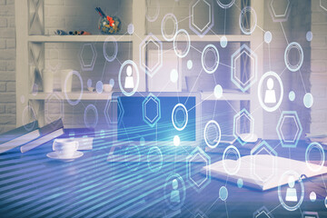 Computer on desktop with social network theme icon. Multi exposure. Concept of international connections.