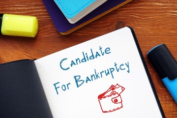 Financial concept about Candidate For Bankruptcy with sign on the page.