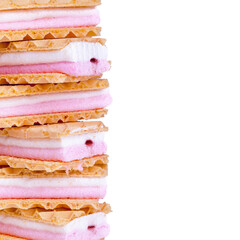 Pink and white wafers isolated on white with space for text