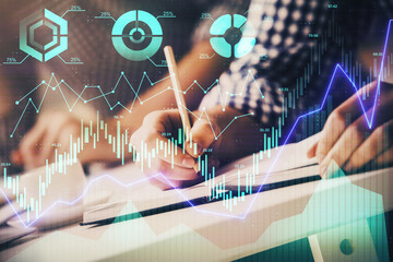 Multi exposure of two men planing investment with stock market forex chart.