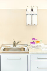 cabinet in the laboratory. hand washbasins liquid soap and test tube equipment