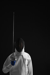 Man holding a fencing foil