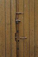 Old brown wooden door with lock