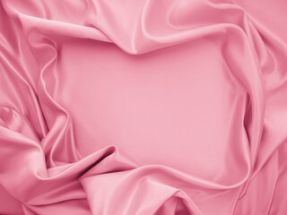 Beautiful smooth elegant wavy light pink satin silk luxury cloth fabric texture, abstract background design. Copy space