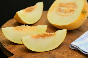 Yellow Melon with slices on a table