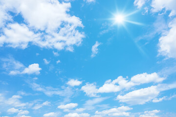 Naklejka na ściany i meble blue sky with sun and clouds background