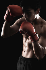 Fototapeta na wymiar Man with red boxing gloves