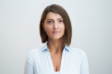 Obraz premium Face portrait of attractive woman over white background