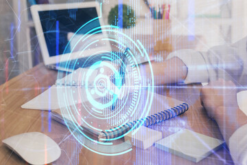 Multi exposure of woman's hands on background with technology and digital coding icons. Data development concept.