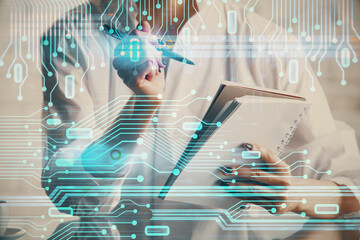 Multi exposure of hands making notes with digital coding icons. Computer learning concept.