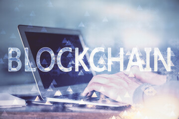 Blockchain theme hud with businessman working on computer on background. Concept of crypto chain....