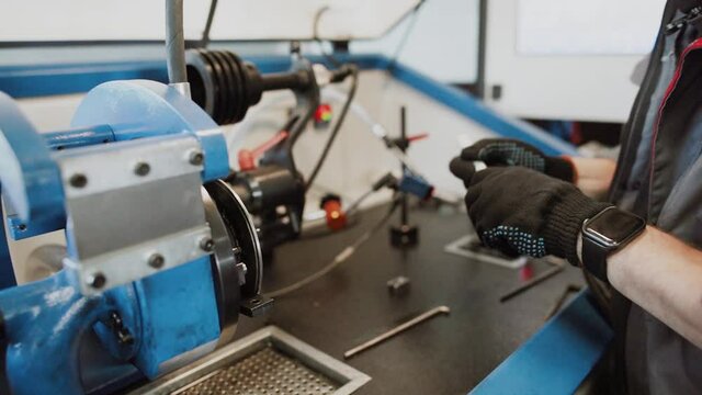 Auto mechanic repairing a car in a workshop.car repair concept