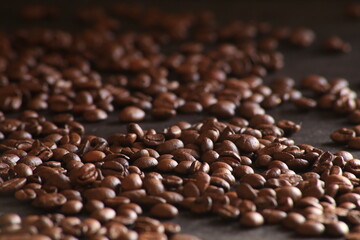 Coffee beans close up in dark ground