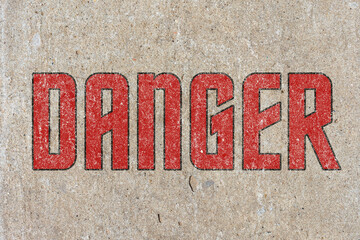 The inscription warning of the danger. Stencil. Old texture.