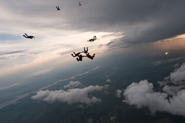 Skydiving. Formations. A group of skydivers is in the sky.