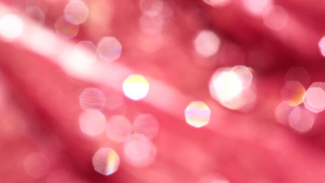 abstract bokeh background  white zoom in effect and red color heptagon snape / bright water drop on red leaf