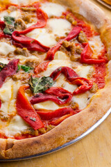 Pizza. Traditional New York City style margarita pizza pie with a thin homemade crispy crust, fresh tomato garlic marinara sauce topped with buffalo mozzarella cheese and fresh basil leaves.