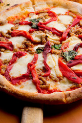 Pizza. Traditional New York City style margarita pizza pie with a thin homemade crispy crust, fresh tomato garlic marinara sauce topped with buffalo mozzarella cheese and fresh basil leaves.