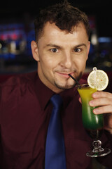 Man enjoying a glass of cocktail