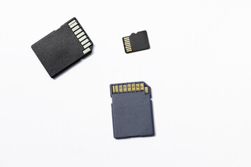 three memory cards on a white background, selective focus,Â space for text