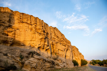 Mountain canyon road view. The road next to the orange rock. Canyon in the mountains. Mountain canyon view