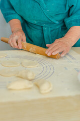 process of sculpting home-made pierogi. Grandma prepares a national Ukrainian dish - vareniki.