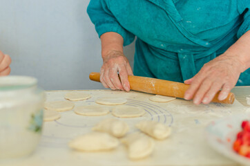 process of sculpting home-made pierogi. Grandma prepares a national Ukrainian dish - vareniki.