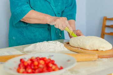process of sculpting home-made pierogi. Grandma prepares a national Ukrainian dish - vareniki.