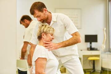 Fototapeta premium Competent chiropractor treats back pain