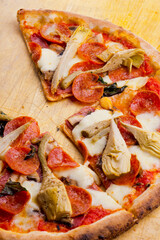 Pizza. Classic traditional Italian entrée favorite. New York Style Pizza with marinara sauce and topped with mozzarella cheese, meats and fresh vegetables. Baked in wood burning oven