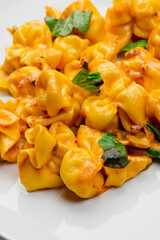 Pasta with meatballs, marinara sauce, Parmesan cheese and fresh Italian parsley. Classic American or Italian restaurant favorite. Homemade pasta with sauces, meats and cheeses.