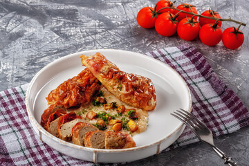 Chicken drumstick ballotin with onion sauce and mushrooms. Stuffed chicken legs