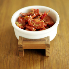 A small bowl of dried tomatoes