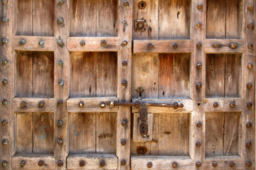 Details of a simple door with brass knobs  ideal for background and texture