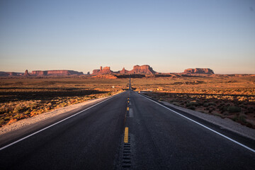 Road shot of Monument Valley at sunrise, in Utah.