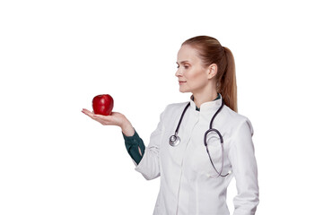 The concept of eating fruits. The doctor has an apple in her hand.