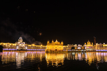 Golden Temple Amritsar lit by Diya and fire crackers Guru Purab festival and Diwali 