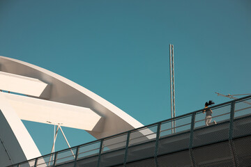 Woman jogging on the bridge